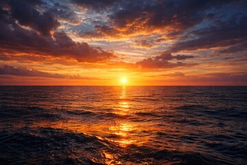 Fototapeta premium Beautiful marine horizon at sundown featuring glowing water and atmospheric sky