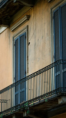 Fototapeta premium Traditional Italian Balcony with Wooden Window Shutters