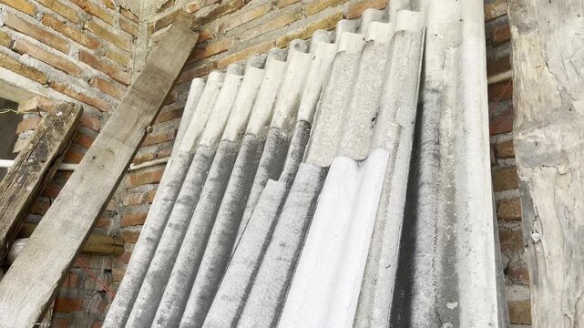 Stacked Corrugated Roofing Sheets at Construction Site