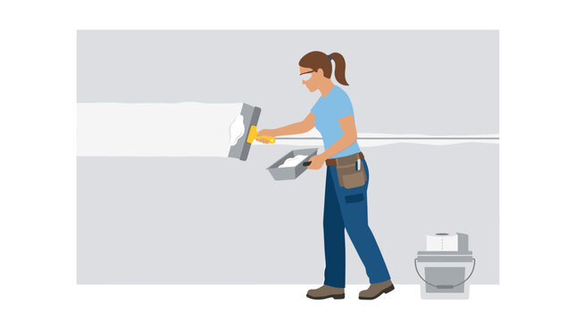 Female professional contractor applying white joint compound to a drywall surface using a metal putty knife while wearing protective safety gear in a renovation.