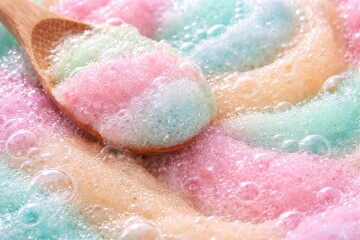 Fototapeta premium Pastel palette exfoliating body scrub close up showing bubble texture ideal for skin care rituals