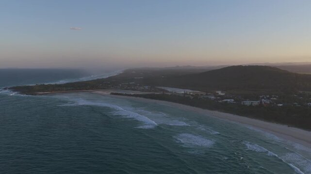 Coastal Scenery At Sunrise Of Hastings Point Lookout, Cudgera Creek Mouth, And Maggies Beach In NSW, Australia. aerial pullback shot