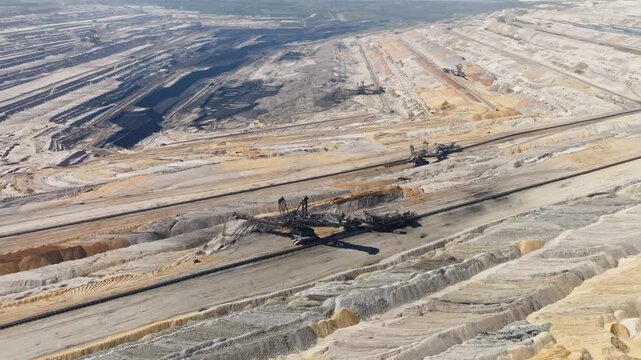 Aerial heavy machine moving in in a vast open cast lignite coal mine
