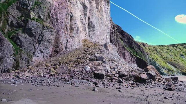 Coastal erosion panning up shot of dramatic sea cliff collapse on Irish Coast Waterford Epic Locations
