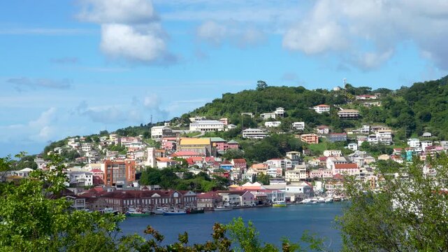Waterfront buildings and lush hillside of St. George's in Grenada, viewpoint