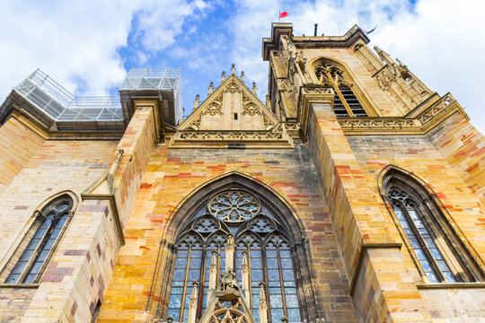 Facade and tower of the historic St. Martin church in Colmar, France