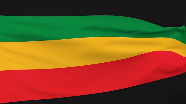 Realistic waving Pan-African flag with green yellow and red stripes on black background 4k loop.