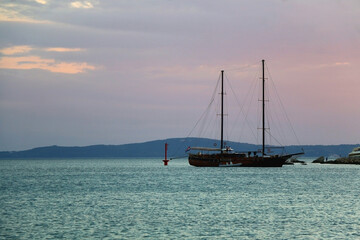 Obraz premium Retro sailing ship during blue hour. Vacation in Croatia.