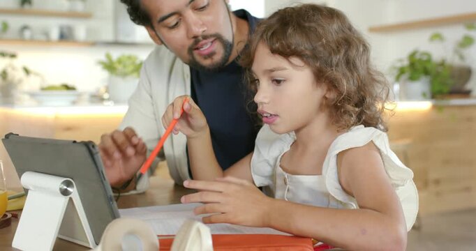 African American dad guiding child, pointing orange pencil at tablet and workbook, counting at home