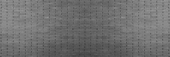 Front view of a wall made of gray slabs. background of a new and modern wall or building exterior grey slabs Marble brick pattern floor abstract natural marble black gray wall Top view and front view © Maxim Chuev
