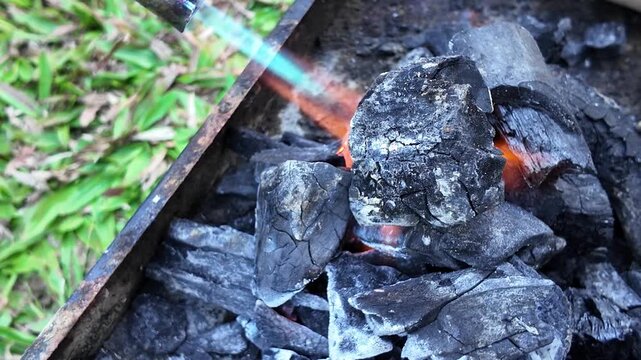 CU: Cinematic Blue Blowtorch Flame Lighting BBQ Charcoal