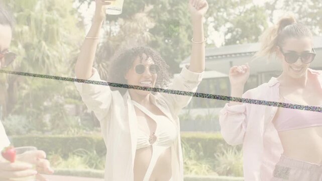 Center woman raising cup starting lifestyle party three women laughing raising drinks swaying pool