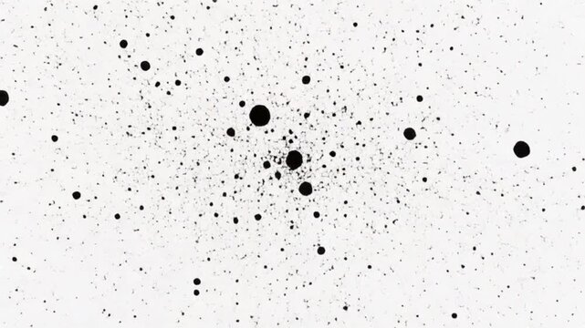 白い背景に黒いインクが飛び散るスプラッターエフェクトと抽象的な汚れ
