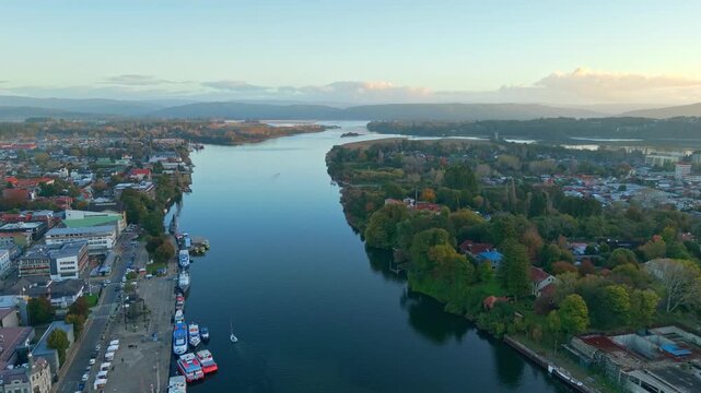 Aerial Dolly In Over CalleCalle River with Valdivia City and Isla Teja Chile nature cityscape