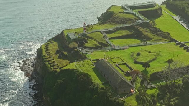 Aerial Dolly Out Establishing of Niebla Fort and Coastal Lighthouse Valdivia Chile