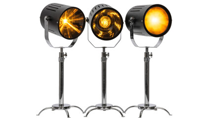 Obraz premium Three studio spotlights on stands illuminating bright yellow light against white background