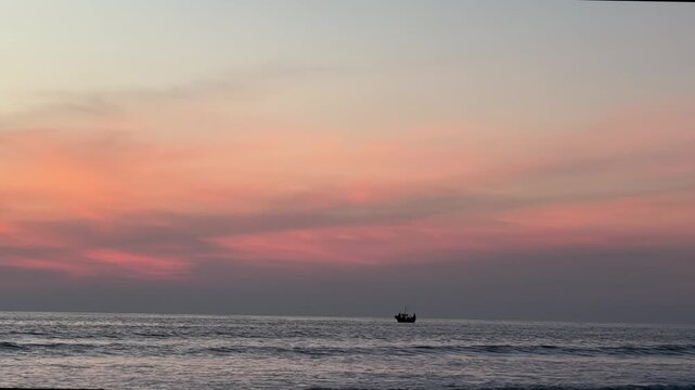 Lonely Boat on Calm Ocean at Sunset 4K Footage. 