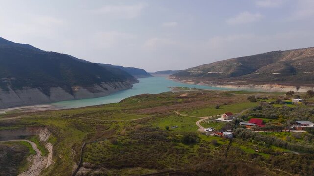 Scenic Aerial Approach to Kouris Dam Reservoir and Agia Paraskevi Church in Limassol