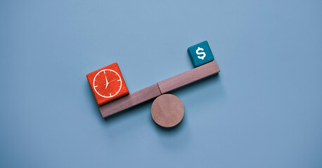 Time versus money concept with balance scale showing clock and dollar symbol blocks, representing...