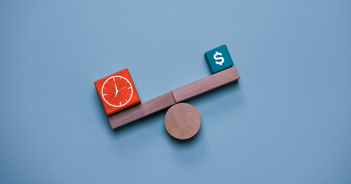 Time versus money concept with balance scale showing clock and dollar symbol blocks, representing productivity, work efficiency, financial management, business strategy and value comparison