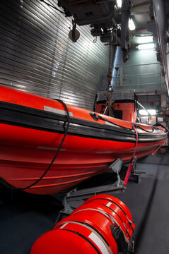 Inside a NATO warship with a lifeboat and an inflatable boat RIB