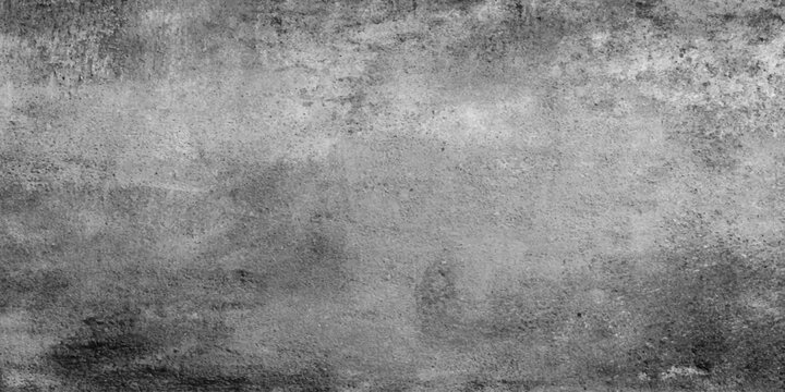 A dark and aged vintage gray paper texture displays a rough and dirty grunge wall surface with a black concrete pattern for a textured cement backdrop design