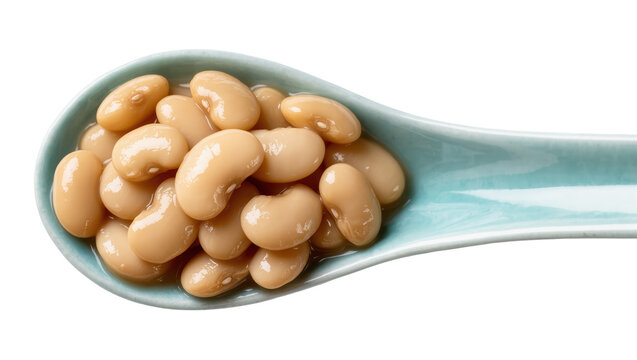 Pale blue ceramic spoon filled with cooked white beans, isolated on transparent background