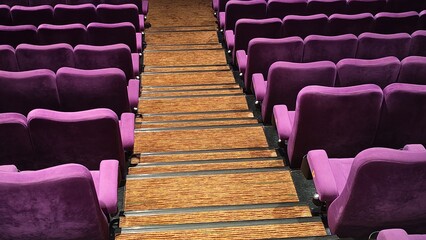 Fototapeta premium rows of cinema seats, purple auditorium