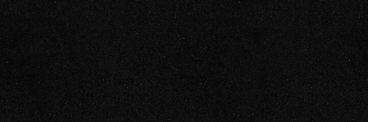 Dark film grain black paper seamless texture background. Old dust and scratch effect backdrop wallpaper.