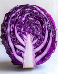 Obraz premium Cross section of a fresh red cabbage showing intricate purple leaves and thick white stem structure close up macro photography