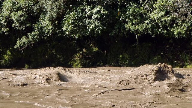 Rio Quijos, Ecuador in flood, A tributary of the Amazon on the eastern slope of the Andes in Ecuador in flood after a tropical storm, slow motion