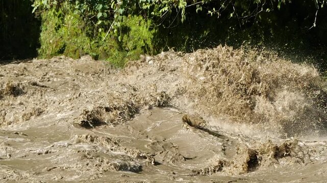 Rio Quijos, Ecuador in flood, A tributary of the Amazon on the eastern slope of the Andes in Ecuador in flood after a tropical storm, slow motion