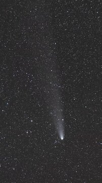 Stunning view of Comet C2023A3 Tsuchinshan-ATLAS with a bright tail moving across the starry night sky above El Medano in the Atacama Desert, Chile, astronomical event and celestial phenomenon
