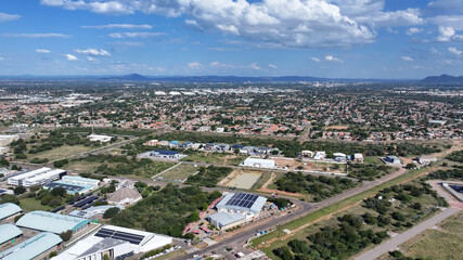 Fototapeta premium Aerial View of Gaborone Industrial Area with Urban Sprawl and Solar Rooftops