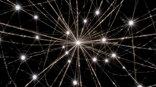 Abstract atom model with orbiting electrons and bright nucleus on dark background