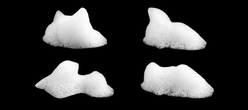 White soap foam bubbles isolated on black background. Abstract cleaning texture with soft detergent lather for hygiene, washing, skincare, sanitation and cosmetic design concepts.