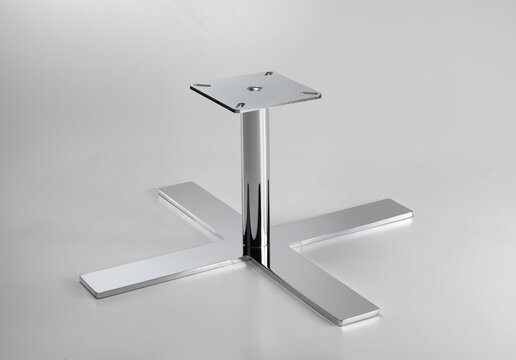 Still life of the iron base of a table, on a neutral background