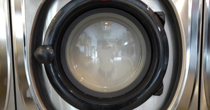 Laundromat washing machine door during a wash cycle