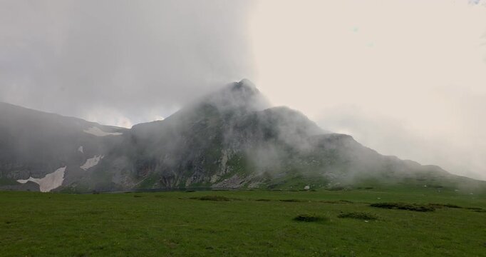 Mountain peak covered in fog in Rila National Park, Bulgaria near Seven Rila Lakes