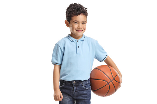 Asian boy smiling and holding a basketball