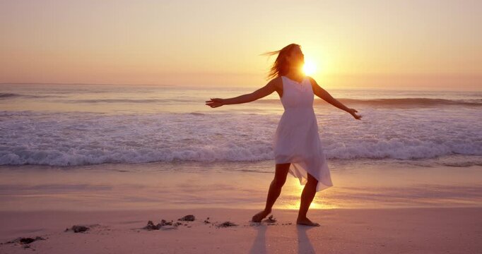 Travel, sunset or woman at ocean with dancing, carefree or peaceful perspective on beach vacation. Flare, seaside waves or tourist with movement, calm mindset or summer evening on holiday break.