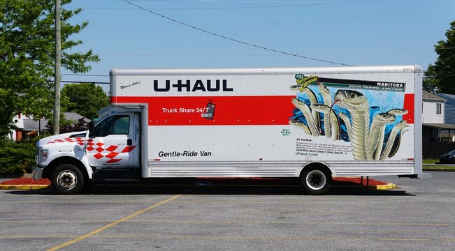 New Castle, Delaware, U.S.A - May 5, 2026 - U-Haul moving truck featuring Manitoba-themed artwork and educational text about red-sided garter snakes.