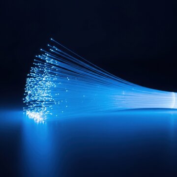 Glowing blue strands of light against dark background