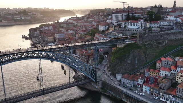 Porto sunset over Dom Luis I Bridge and Douro River aerial