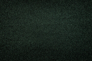 Fototapeta premium Textured black surface shows fine details and patterns under light in a simple and clear setting