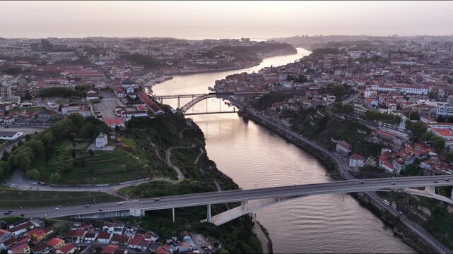 Porto Portugal cityscape at sunset overlooking Douro River and bridges