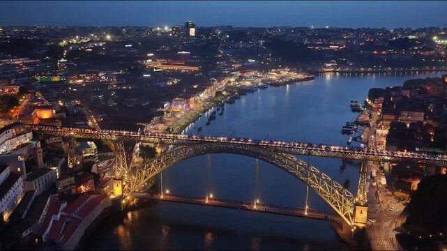 Porto night lights over Dom Luis I Bridge and Douro River cityscape