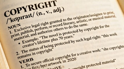 Fototapeta premium This shows a close-up view of a dictionary page that provides a detailed definition of the term copyright, emphasizing its relevance to intellectual property rights and legal protections for creative
