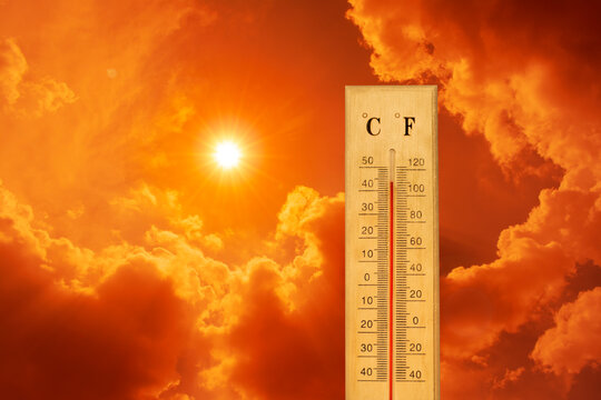 The thermometer showed a high temperature against a sweltering orange sky.