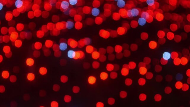 Abstract red light bokeh background with glitter